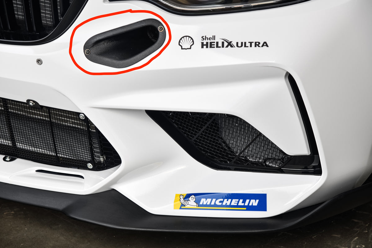 Genuine BMW Motorsport M2 CS Racing Brake Ducts installed on a high-performance BMW M2 CS racing car, showcasing the aerodynamic design.