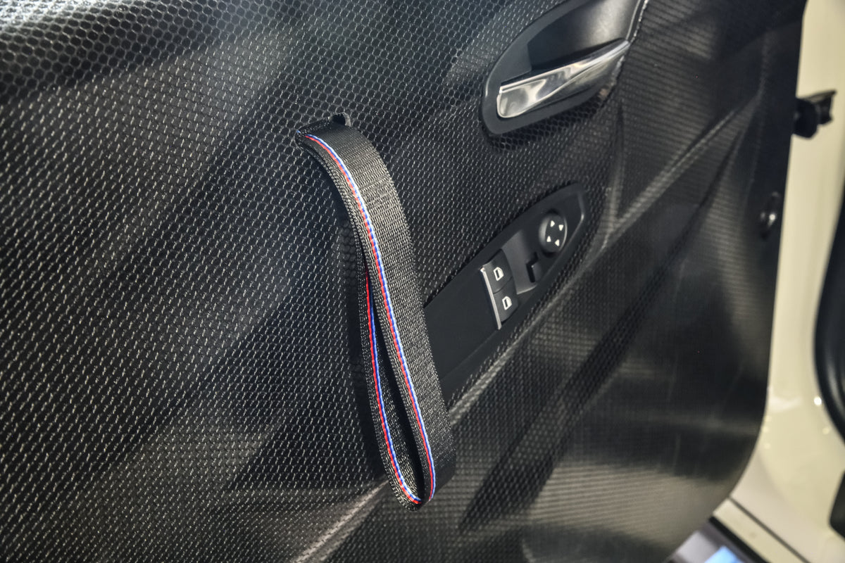 Genuine BMW Motorsport M2 CS Racing door cards with black and red accents, high-quality materials and racing-inspired design.