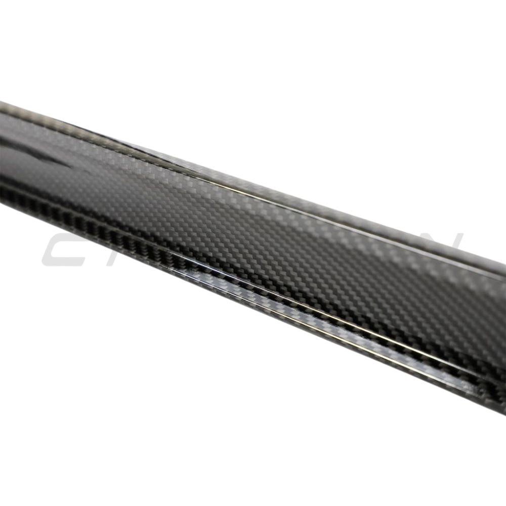 Porsche 911 992 Carrera carbon fibre side skirts by CT Design, showing sleek aerodynamic design and textured carbon finish.