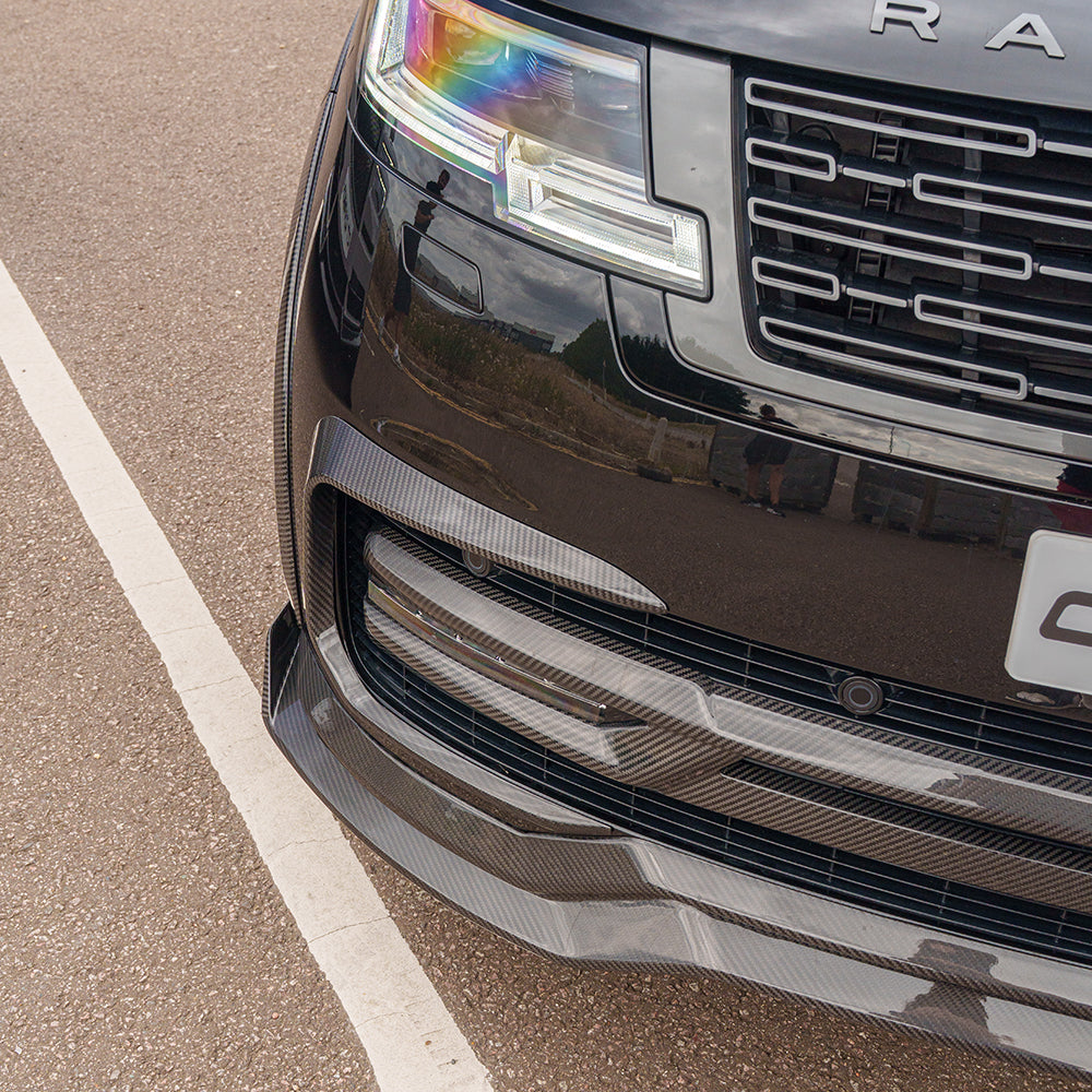 Range Rover L460 2022+ carbon fiber front bumper grille trim by CT Carbon, showcasing sleek, lightweight automotive accessory details.