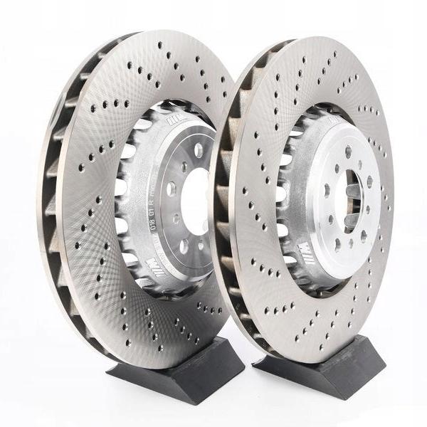 Genuine BMW M2 Competition front brake discs, 400mm size, with brake pads, shown on a BMW M2 F87 vehicle.