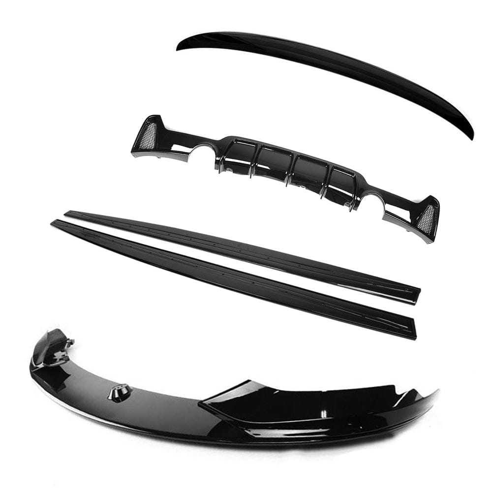 BMW 4 Series F32 gloss black full kit with dual exhaust tips by CT Carbon, featuring sleek MP style design.