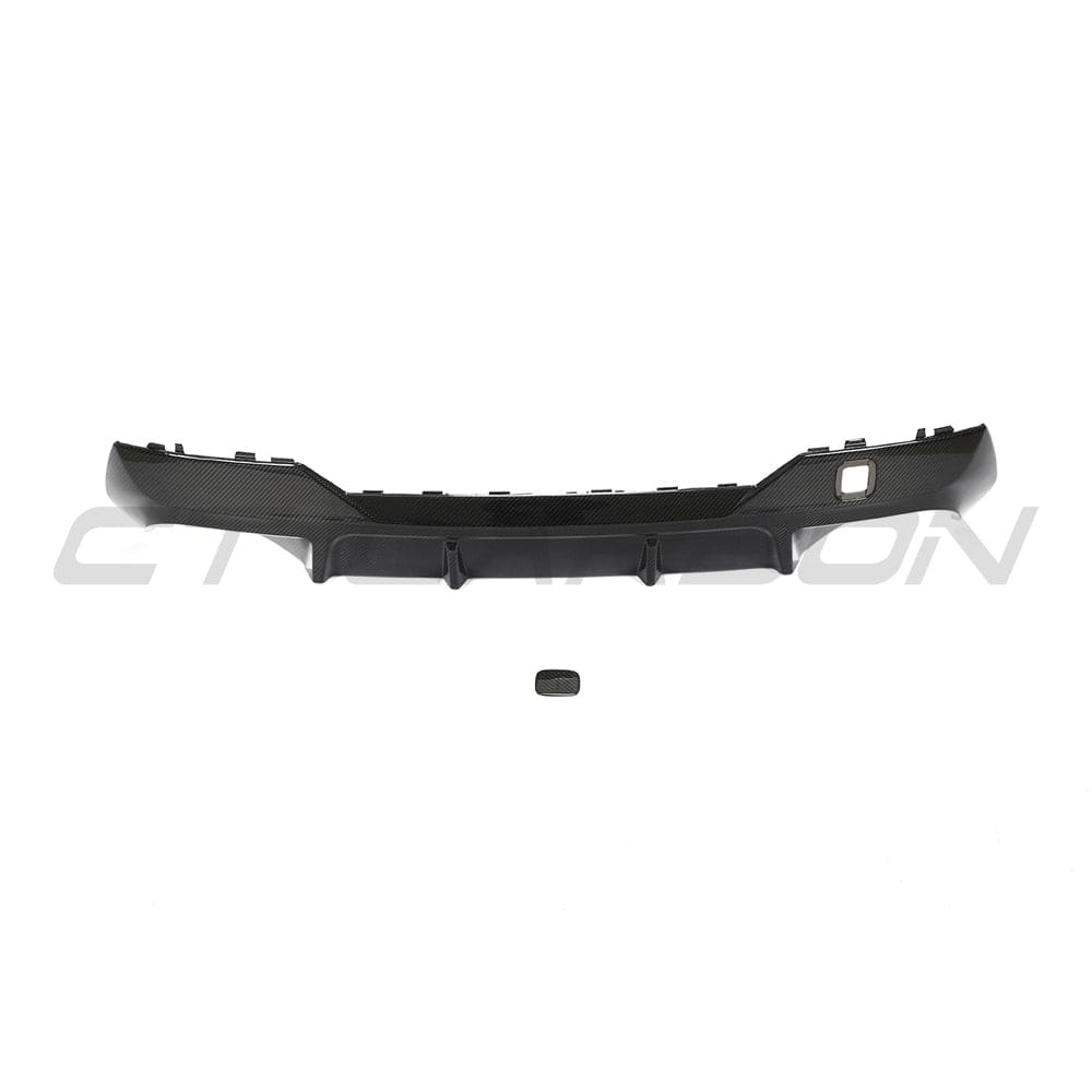 Black BMW G22 4 Series carbon fiber diffuser kit by CT Carbon, featuring sleek carbon fiber design for sporty style and enhanced aerodynamics.