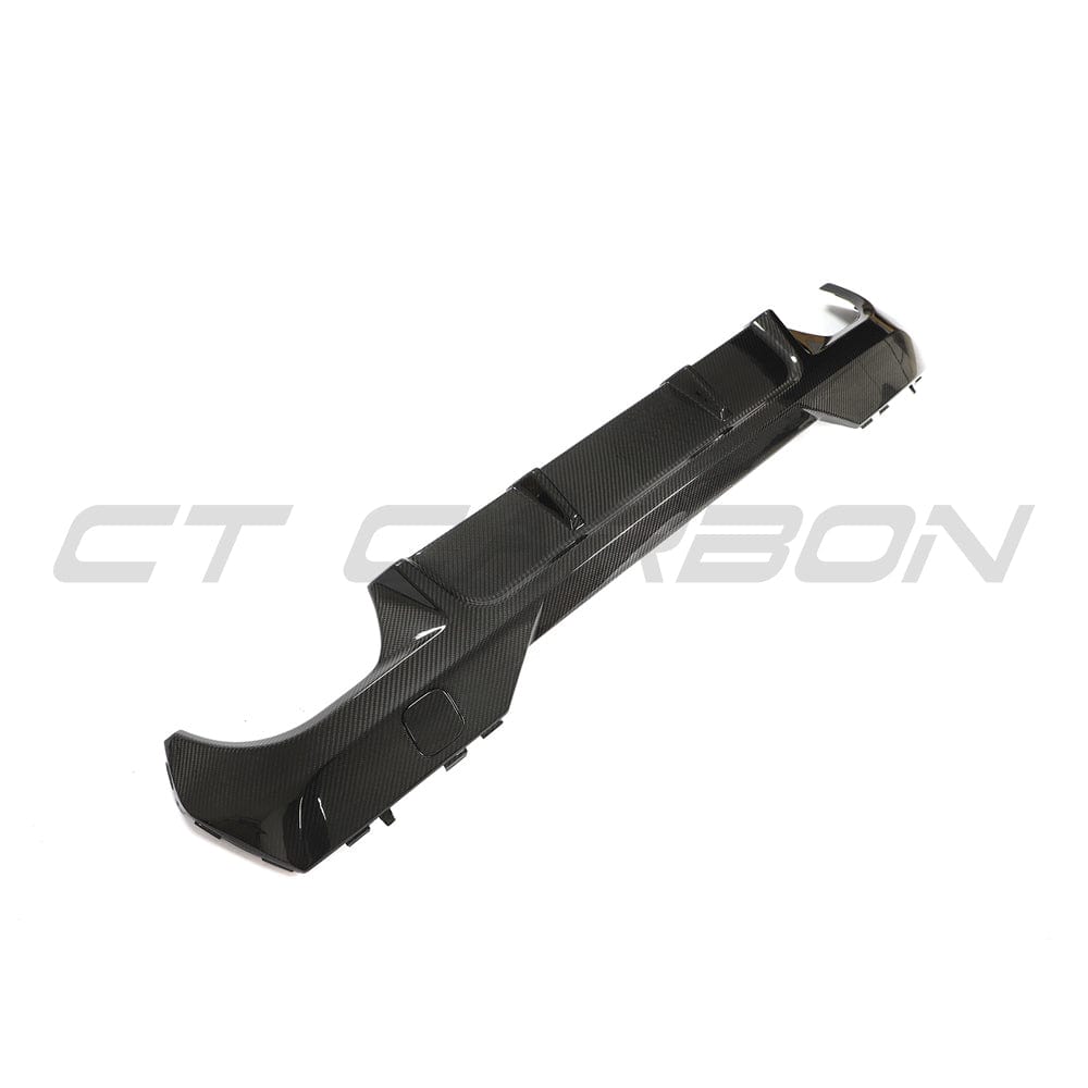 Black BMW G22 4 Series carbon fiber diffuser kit by CT Carbon, featuring sleek V10 carbon fiber design for sporty style.