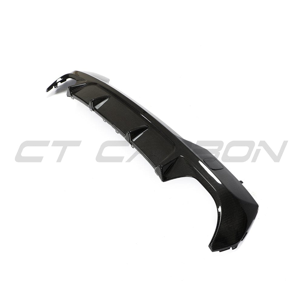 Black BMW G22 4 Series carbon fiber diffuser kit by CT Carbon, showcasing sleek, lightweight carbon fiber parts for enhanced style.