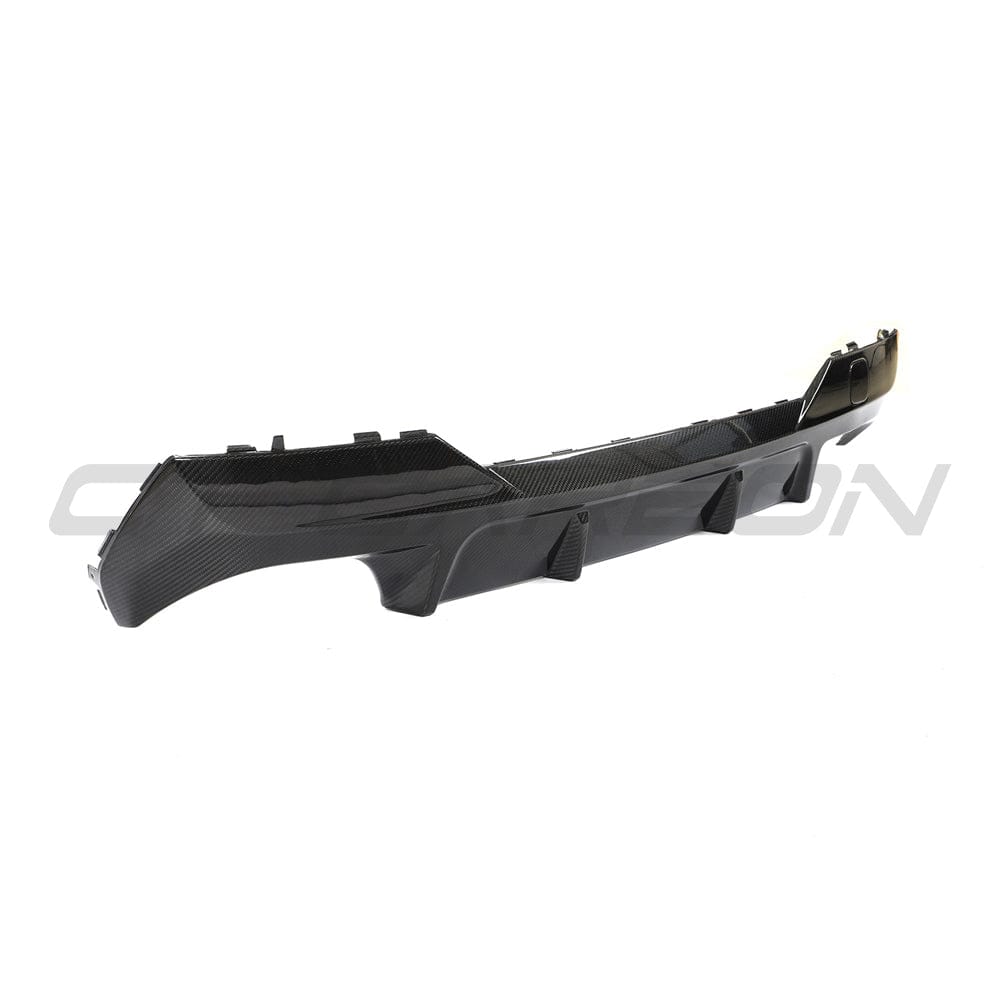 Black BMW G22 4 Series carbon fiber diffuser kit by CT Carbon, featuring a sleek carbon fiber spoiler and stylish details.