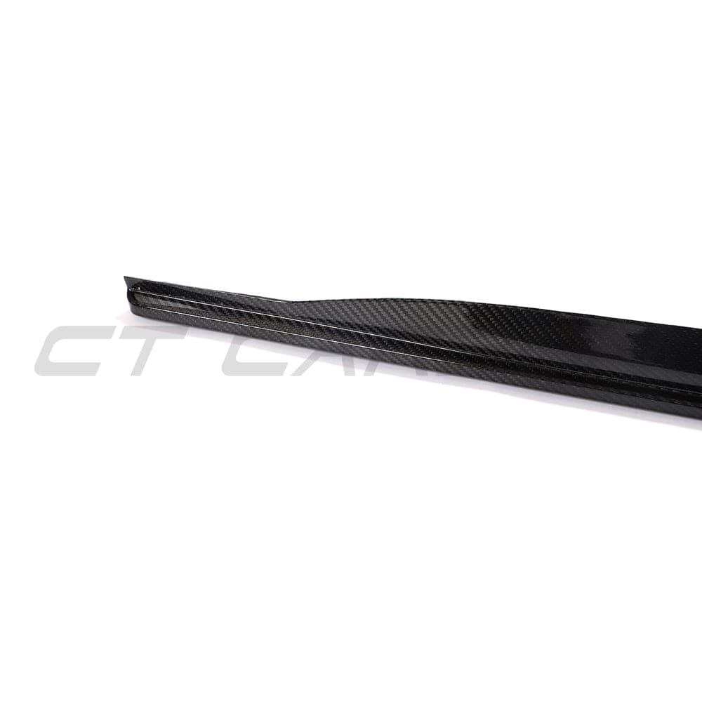 Black BMW G22 4 Series carbon fibre side skirts and diffuser kit by CT Carbon, showcasing sleek, high-performance automotive styling.