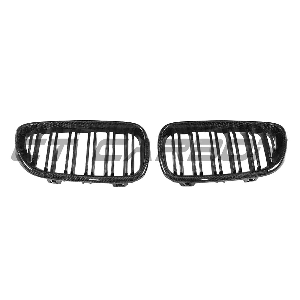 BMW F87 M2 carbon fibre grille kit by CT Carbon, featuring sleek, lightweight carbon fibre components on a sporty M2 model.