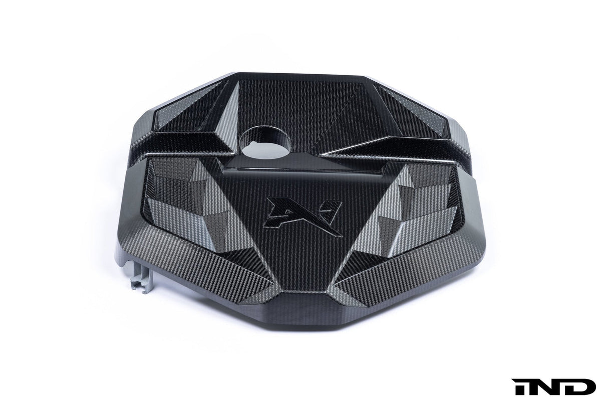 Carbon fiber engine bay cover for BMW M2 G87 by AlphaN, showcasing sleek black carbon fiber with precise fit and branding details.