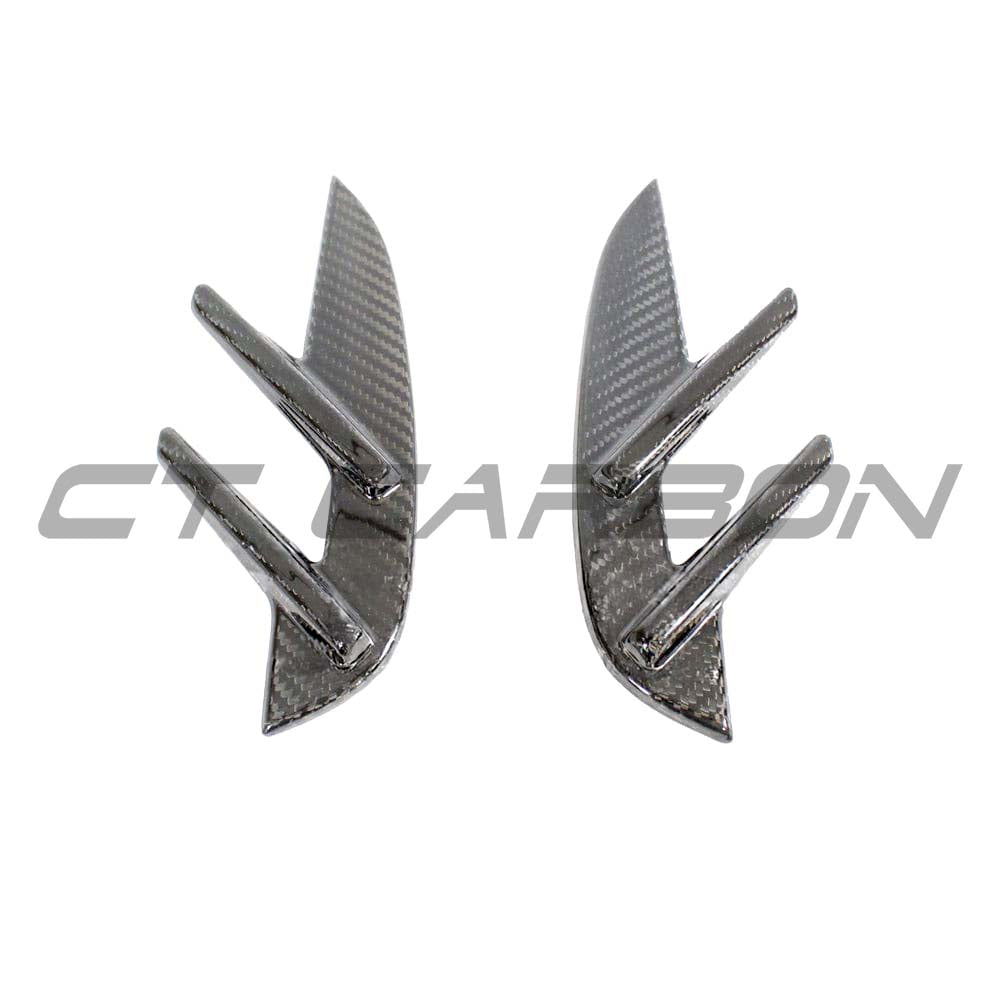BMW M3 G80 G81 carbon fiber side fender trim by CT Carbon, close-up of sleek, lightweight automotive accessory on vehicle side.