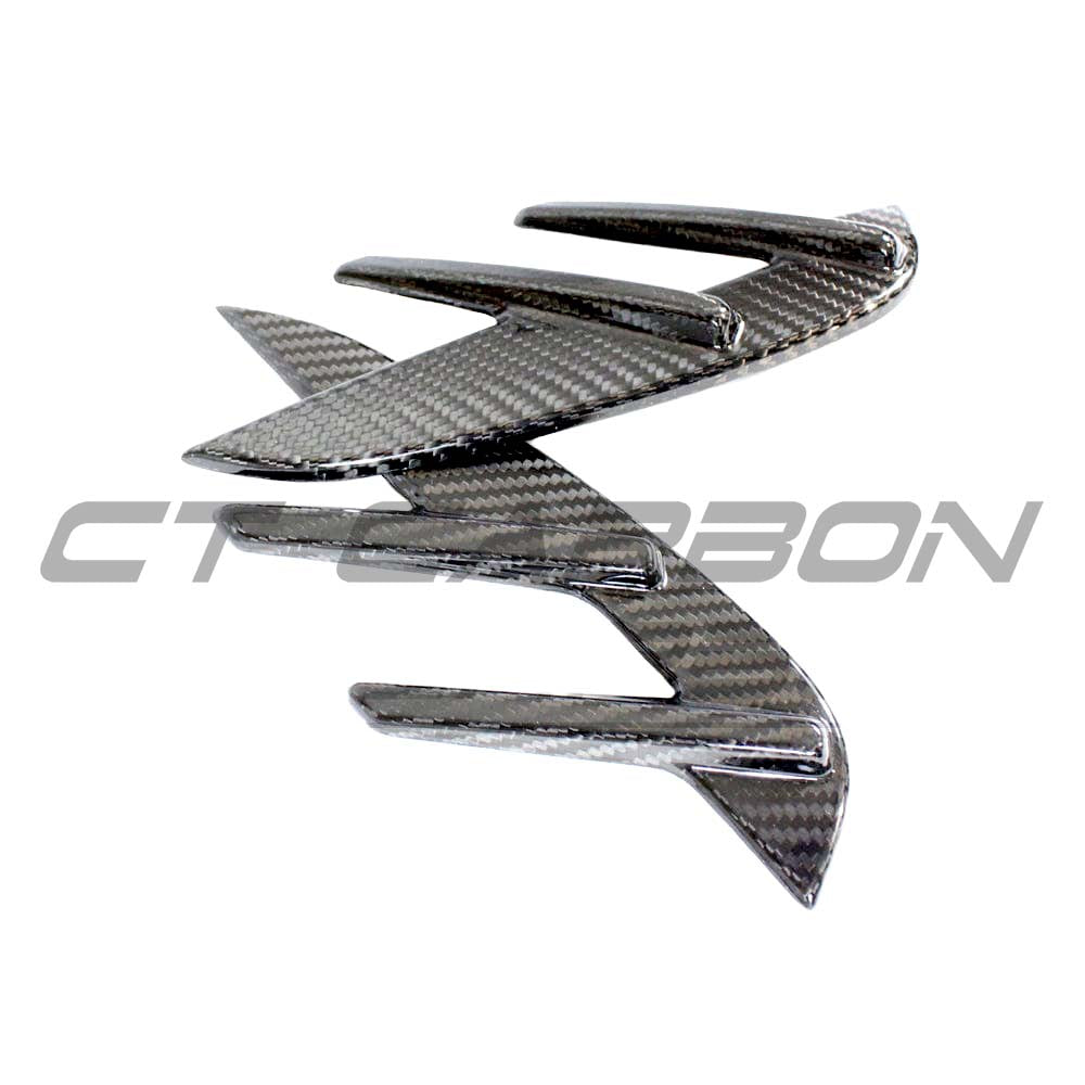 BMW M3 G80 G81 Carbon Fibre Side Fender Trim by CT Carbon, close-up view of sleek car accessory with textured carbon fiber finish.