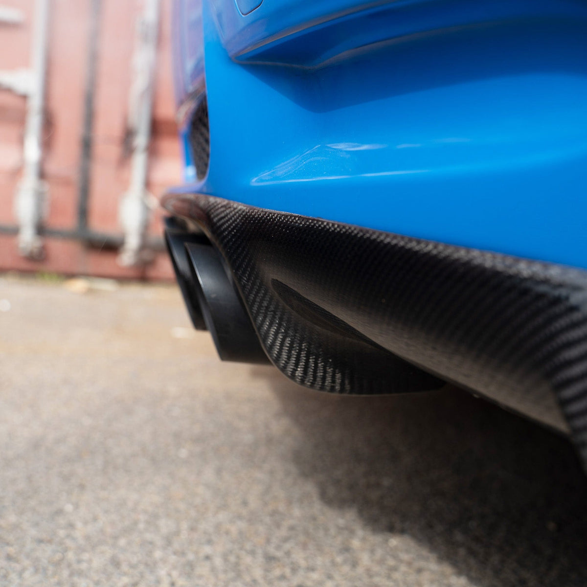 BMW E92/E93 M3 carbon fibre diffuser by CT Carbon, showcasing the sleek, lightweight automotive exhaust diffuser with textured finish.