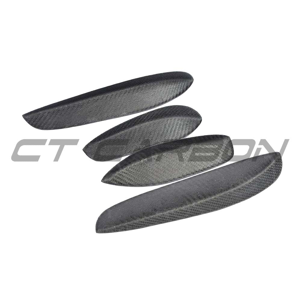 Carbon fiber canards for Mercedes W205 C63 C63S front bumper, manufactured by CT Carbon, featuring aerodynamic fins for enhanced performance.