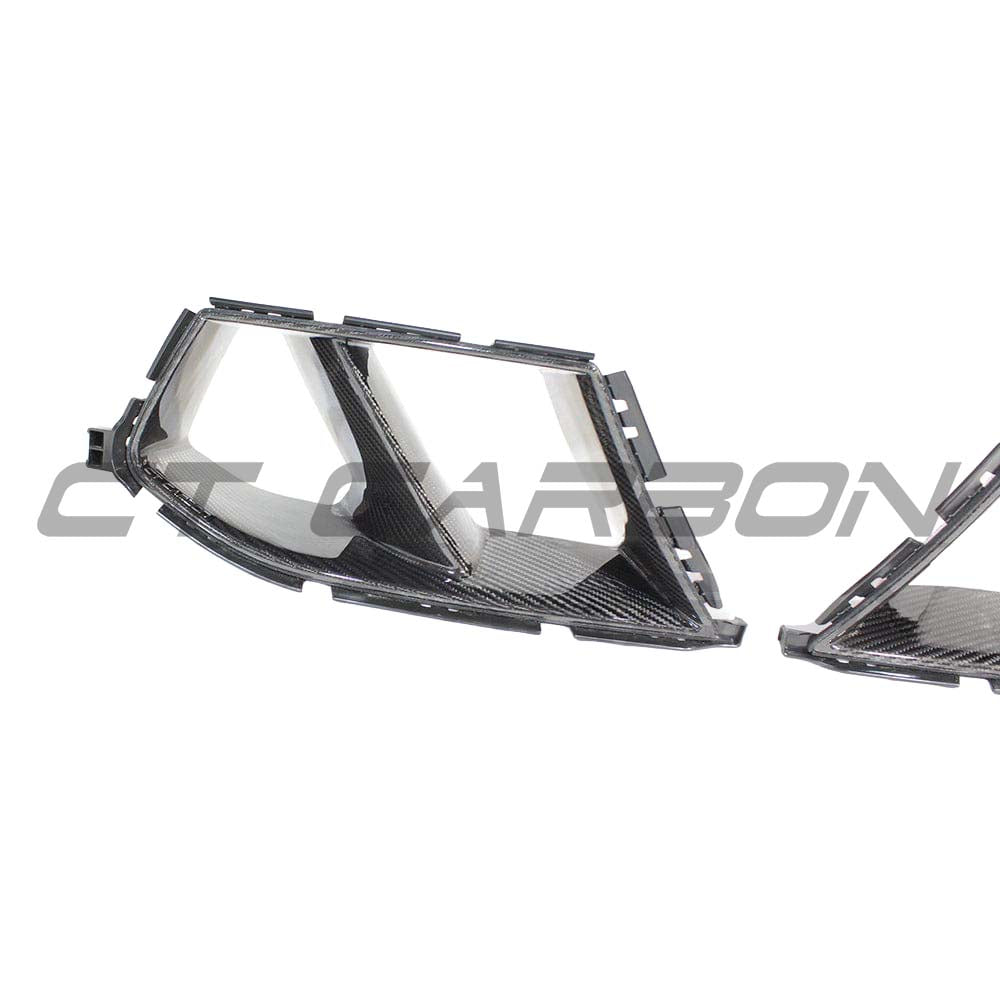 BMW M3 M4 G80 G82 G83 carbon fibre bumper ducts by CT Carbon, showcasing sleek, lightweight accessory details.