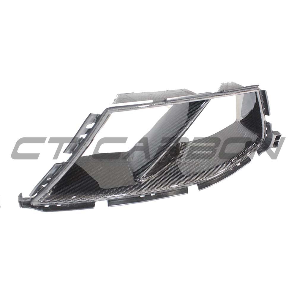 BMW M3 M4 G80 G82 G83 carbon fibre bumper ducts by CT Carbon, showcasing high-performance automotive accessory, front view.