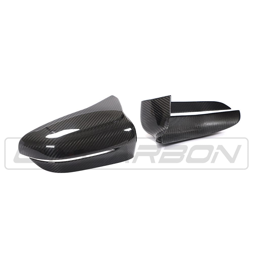 BMW F90 M5 M5C Competition carbon fibre mirror overlay by CT Carbon, RHD, showing sleek textured finish on side mirror covers