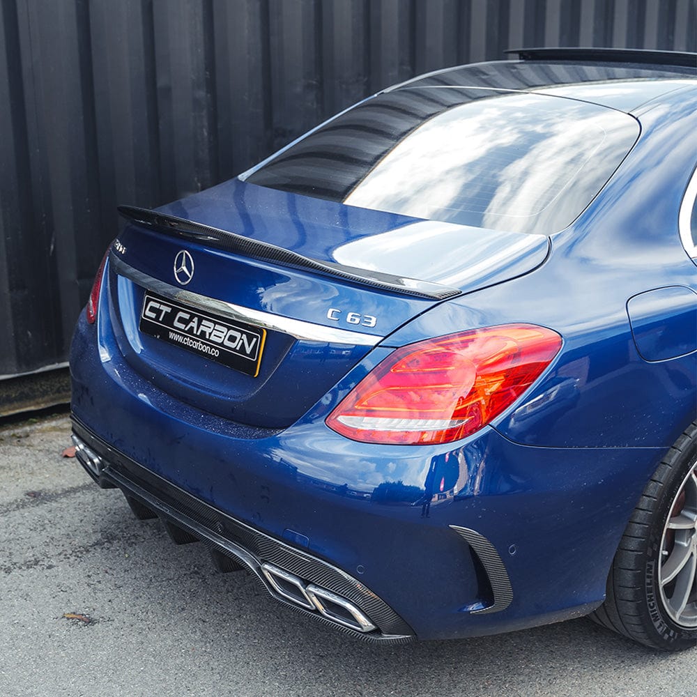Carbon fibre rear bumper canards for Mercedes W205 C63 and C43 saloon, by CT Carbon, enhances sporty rear-end appearance.