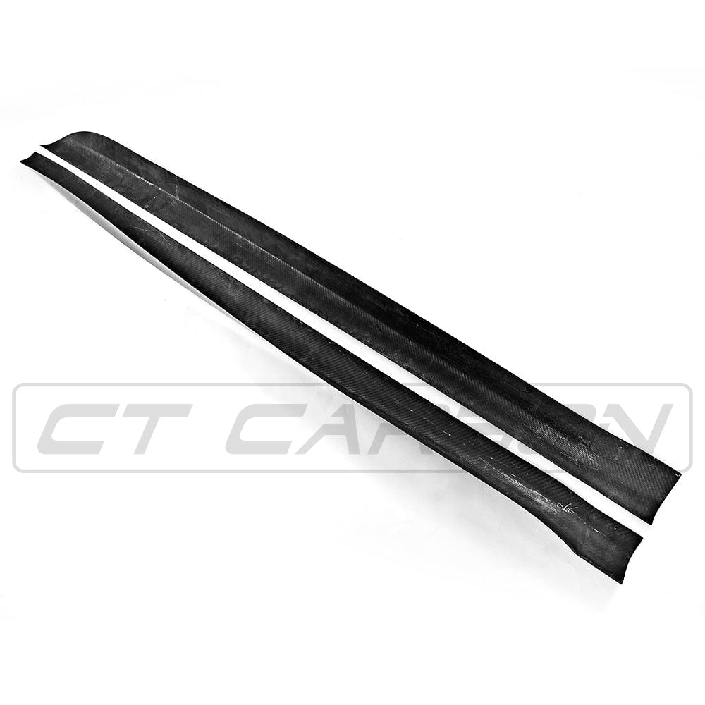 BMW F15/F85 X5/X5M carbon fibre side skirts by CT Carbon, showing sleek, textured side skirt design on vehicle.