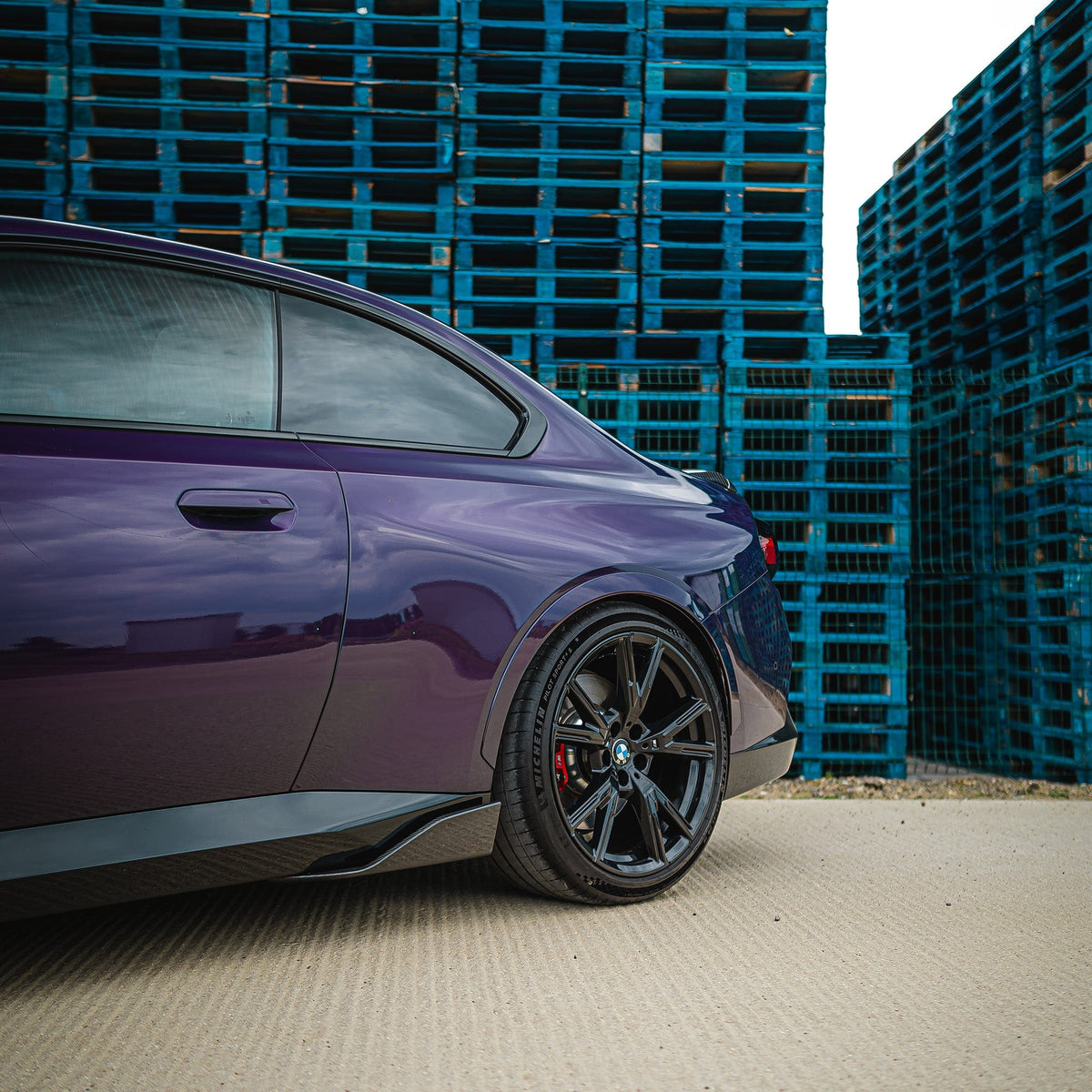 BMW G42 2 Series carbon fibre side skirts by CT Carbon, featuring sleek MP style design on a sporty vehicle.