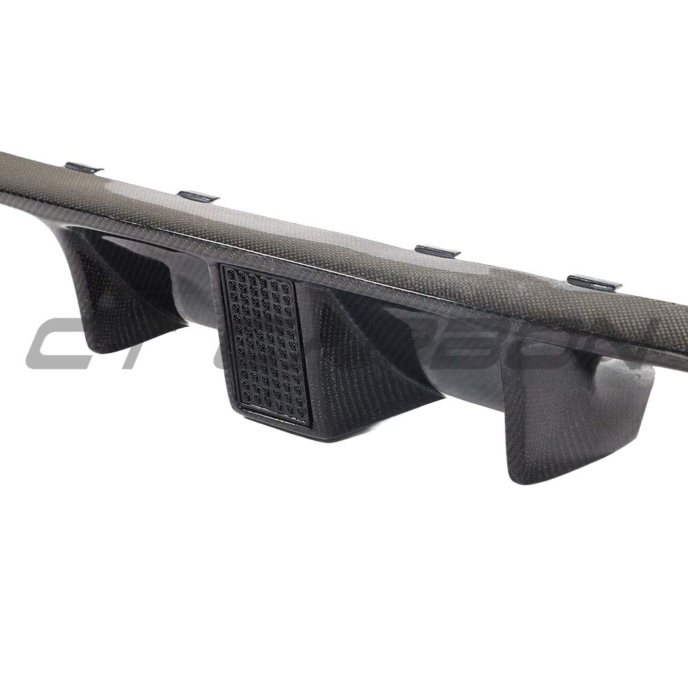Full carbon fiber BMW M3 F80 diffuser with DTM light, designed for M4 models, by CT Carbon, showcasing sleek, lightweight aerodynamic styling.