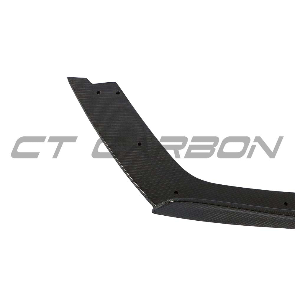 CT Carbon carbon fiber rear bumper corners for BMW M3 M4 F80 F82 F83, close-up of sleek, textured carbon fiber bumper accessories.