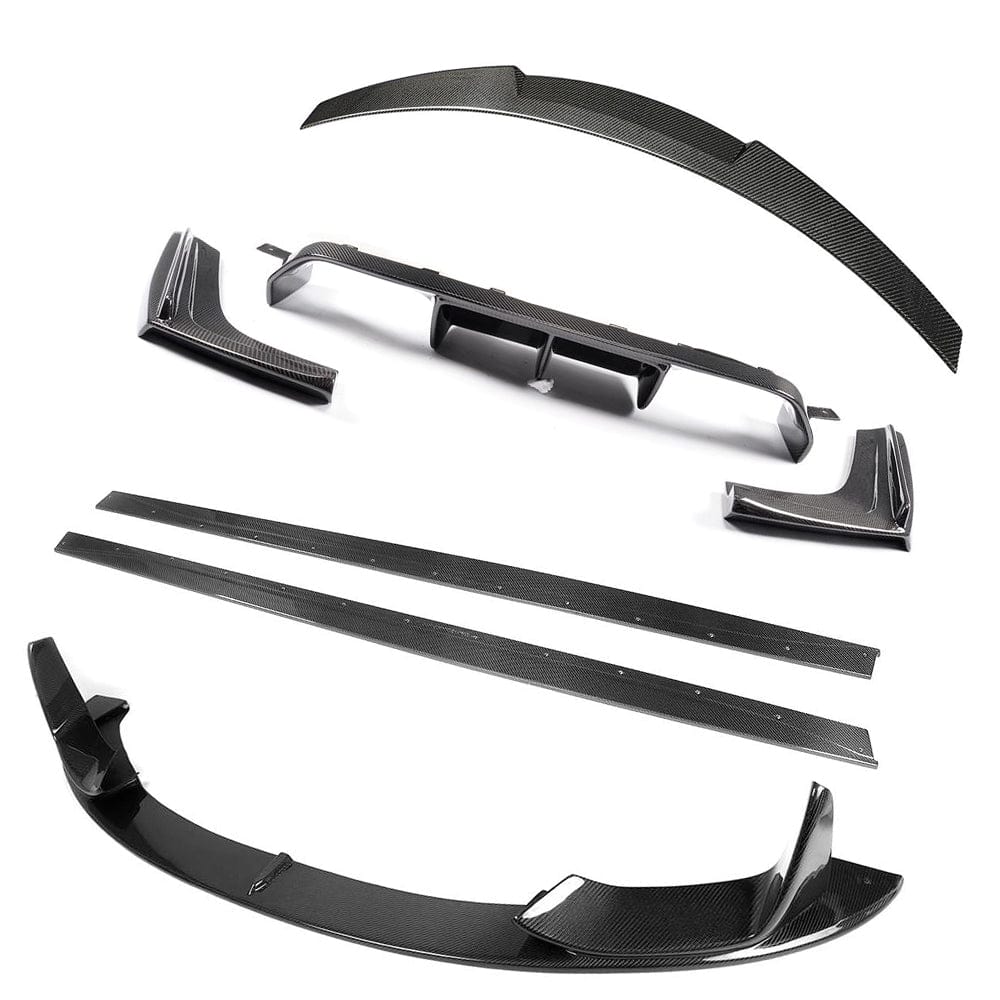 BMW F82 M4 Coupe 2014-2020 CT Carbon full carbon fiber kit, including splitter and aerodynamic components, on a black car.
