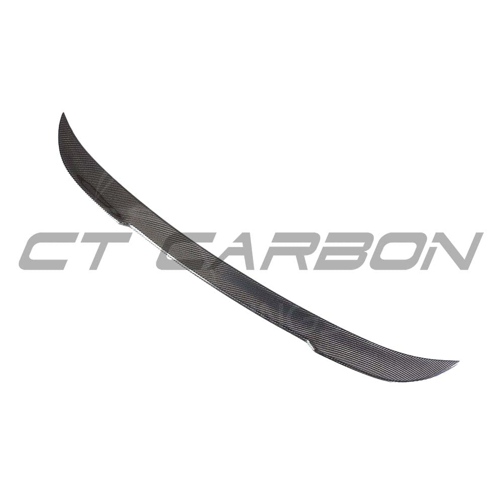 BMW M5 F90 and G30 5 Series carbon fiber spoiler by CT Carbon, showcasing sleek, aerodynamic design and textured carbon finish.