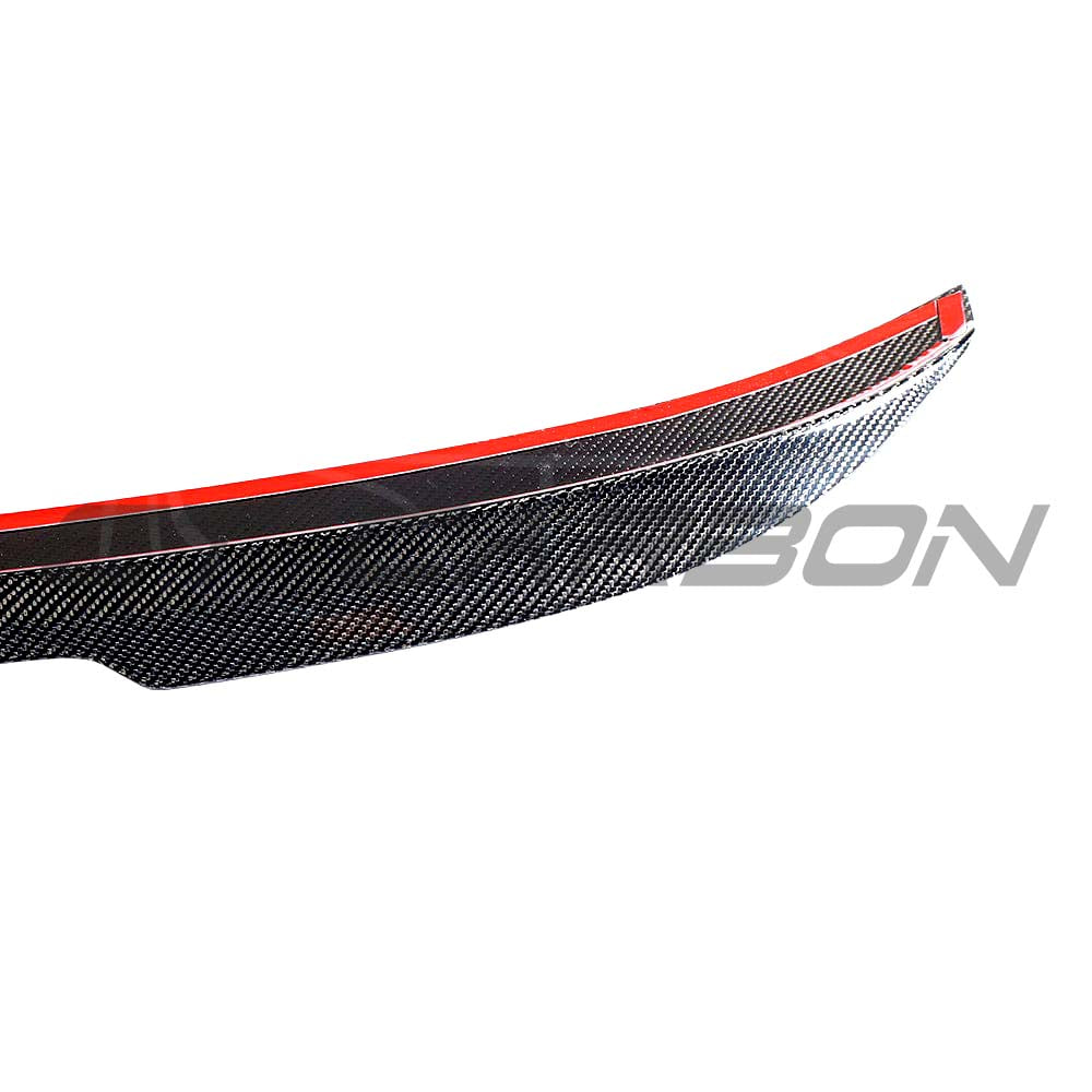 BMW M5 F90 and G30 5 Series carbon fibre spoiler by CT Carbon, showcasing a sleek, aerodynamic design on the car.