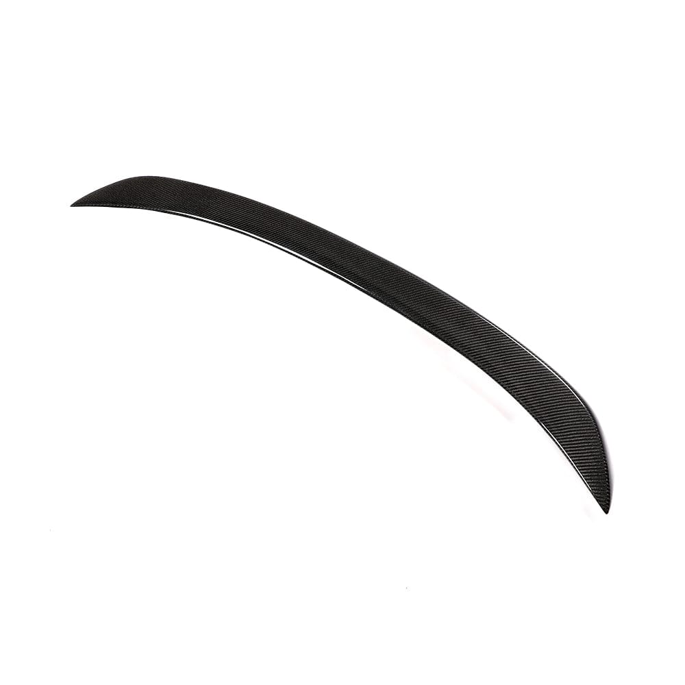 BMW F10 M5 and 5 Series carbon fiber spoiler by CT Carbon, showcasing a sleek V-style design on a sporty car.