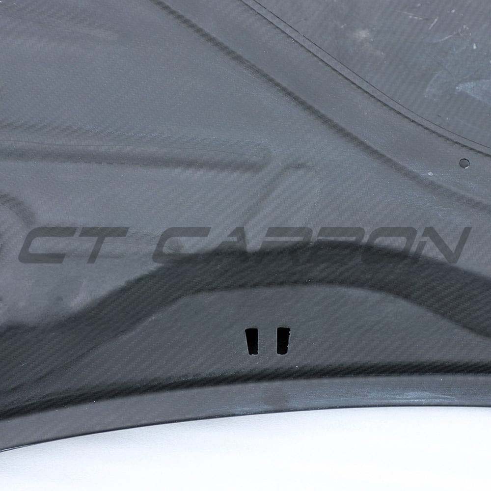 BMW M2 and 1 Series carbon fiber bonnet by CT Carbon, showcasing lightweight, high-performance automotive hood with carbon fiber finish.