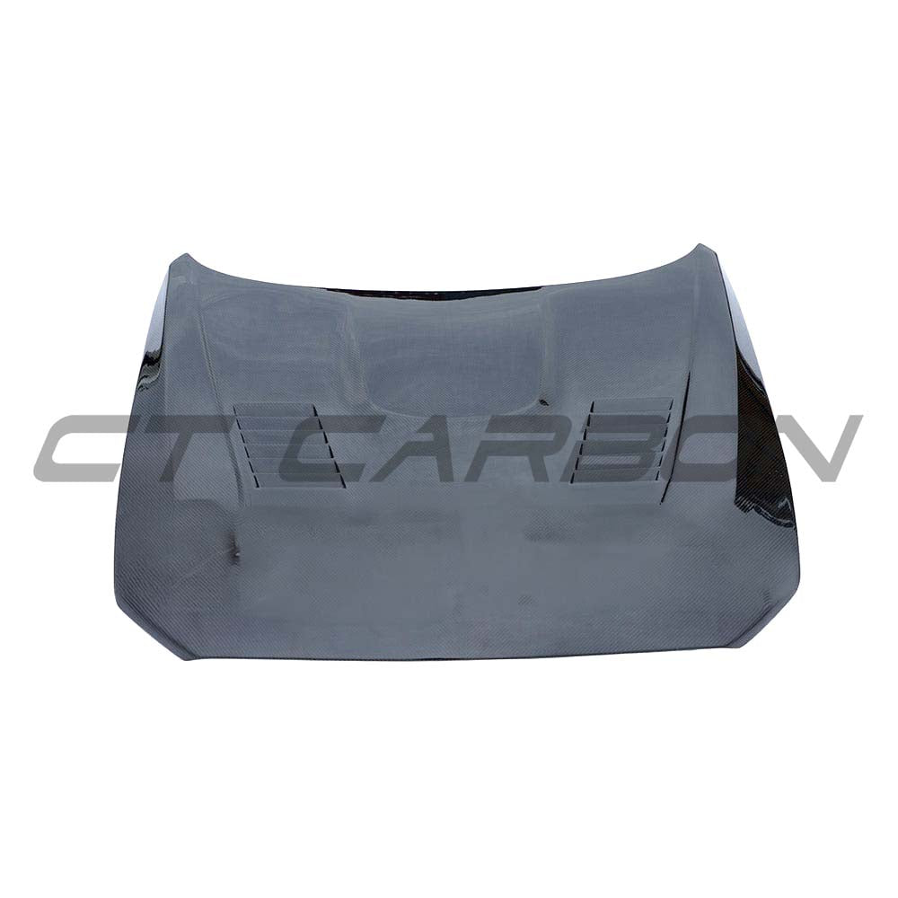 BMW F87 M2 Carbon Fibre Ultimate Kit by CT Carbon, featuring a sleek carbon fiber bonnet on a sporty M2 vehicle.