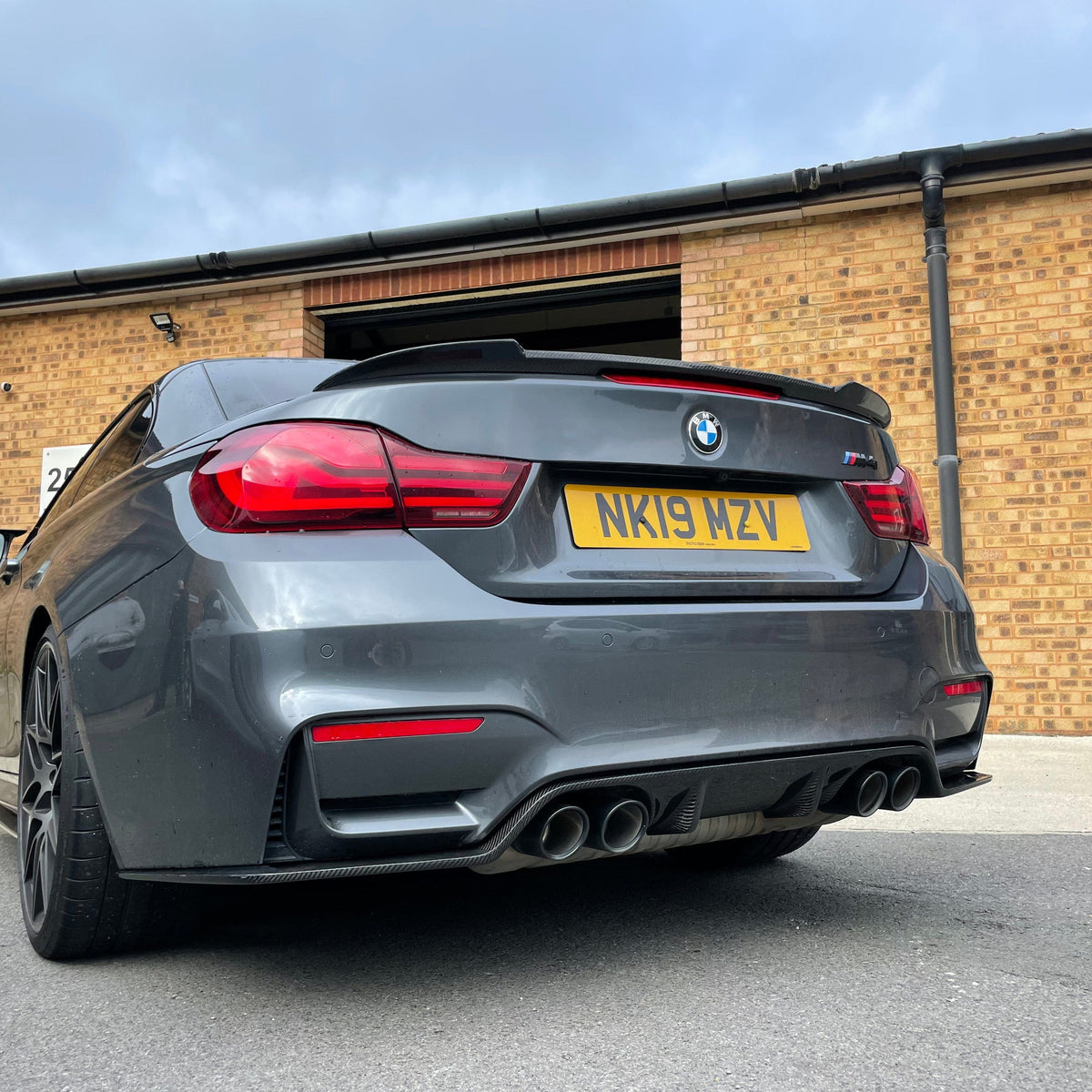 BMW M4 F83 F33 4 Series carbon fiber spoiler by CT Carbon, showcasing a sleek performance-style rear boot spoiler.