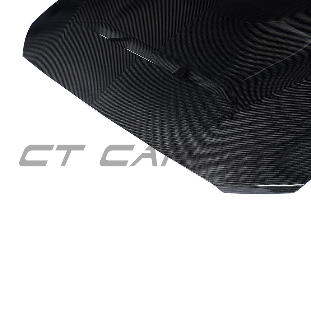BMW F87 M2, M2C, F20, F22 carbon fiber bonnet by CT Carbon, showcasing lightweight, aerodynamic design and textured finish.