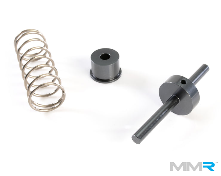 MMX Performance N54/N55 low temp thermostat for BMW M135i engine, showing the compact automotive engine part.