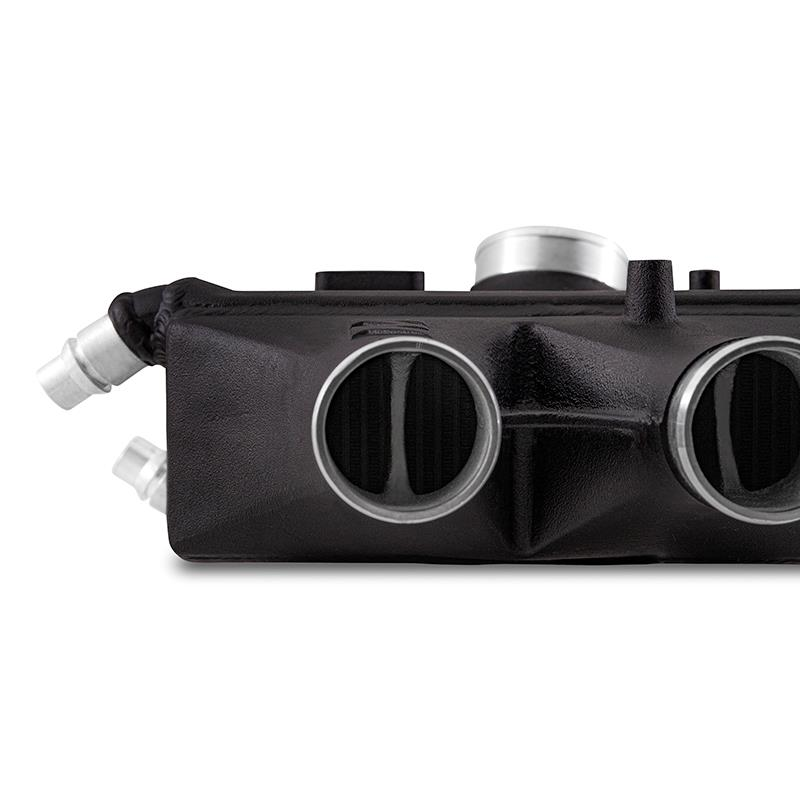 MISHIMOTO performance air-to-water intercooler for BMW F8X M3 M4 2015-2020 engine cooling system, shown installed on vehicle.